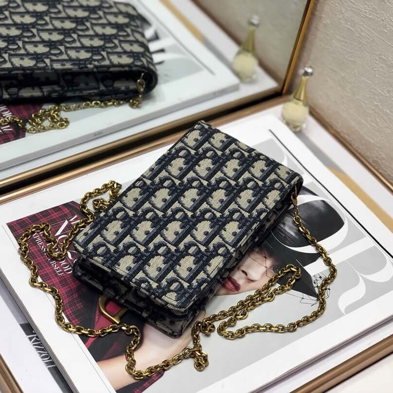 迪奧專櫃手機包藍色提花帆佈手拿包S5641CTZQ_M928￥880.00的图片-高仿迪奧包包DIOR、高仿迪奧女包DIOR