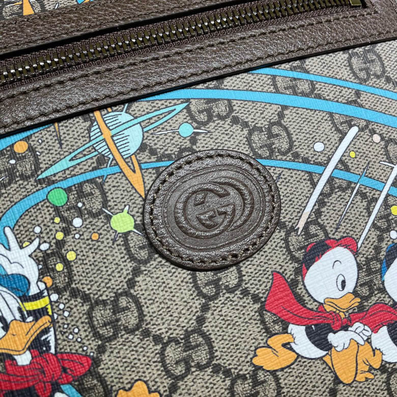 原單GUCCI古馳Disney x唐老鴨印花郵差包645054￥1380.00的图片-高仿古奇包包Gucci、高仿古奇男包Gucci