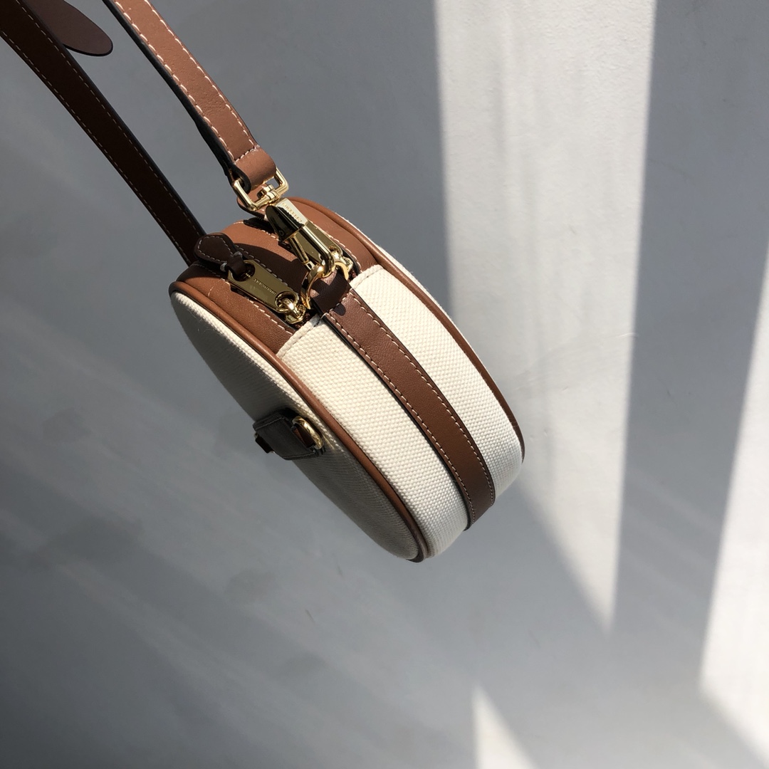 B家路易威登LV雙拉圓餅包高仿包包款可斜背或卸下背帶締造手拿包造型的图片-高仿LV包包、高仿lv女包