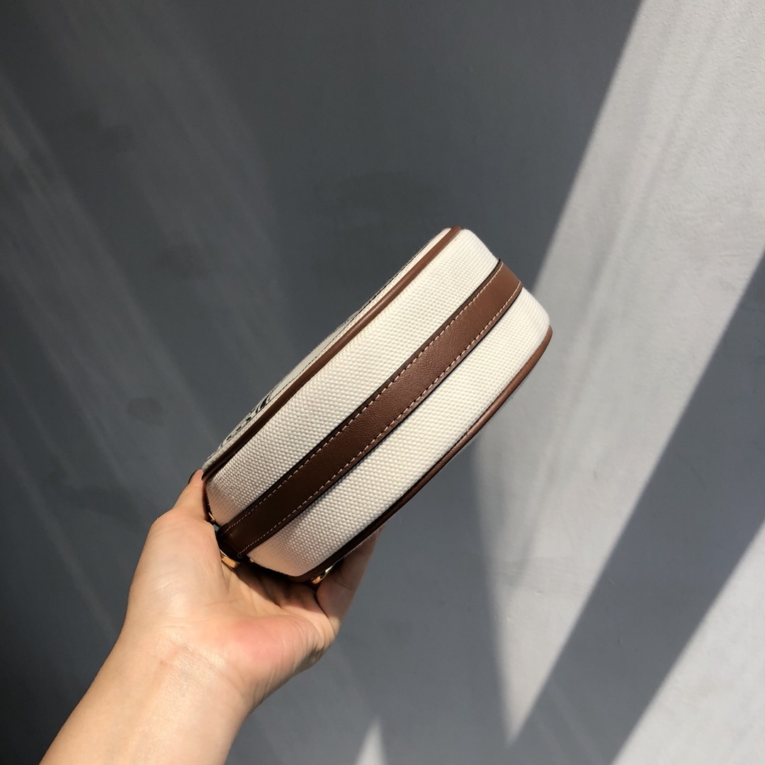 B家路易威登LV雙拉圓餅包高仿包包款可斜背或卸下背帶締造手拿包造型的图片-高仿LV包包、高仿lv女包